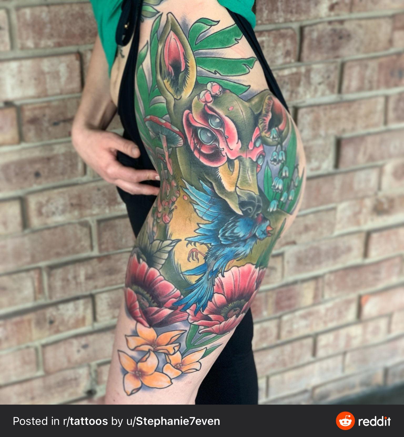 Vibrant Japanese-inspired artistry transforms this leg into a living canvas where mythical creatures dance among blooming lotus petals and tropical foliage. The masterful color saturation and traditional irezumi techniques create stunning depth, with blues and greens that seem to shimmer against the skin while delicate plumeria flowers add a touch of paradise at the ankle. 🌺