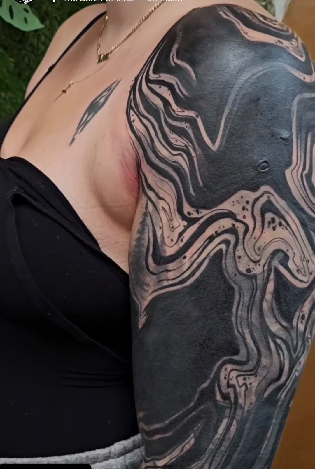 Flowing like liquid marble across the shoulder and arm, this mesmerizing tattoo captures the hypnotic beauty of swirling ink in water. The artist's masterful use of negative space creates depth and movement, with delicate stippling adding texture to the organic, wave-like forms that seem to dance across the skin. 🌊 Pure artistry that transforms the body into a living canvas of fluid motion.