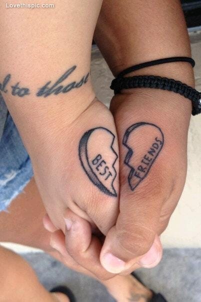 Two hands become one complete heart in this beautifully coordinated couples' tattoo, where 