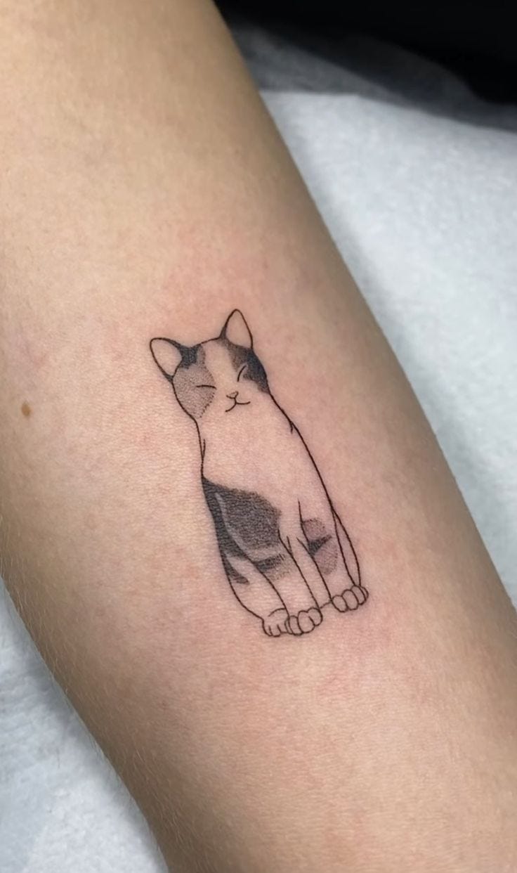 Delicate linework brings this serene feline to life on the forearm, capturing a moment of pure contentment with closed eyes and relaxed posture. The minimalist black ink style perfectly showcases the cat's peaceful expression, while subtle shading adds depth to its striped markings 🐱 A beautiful tribute to our feline companions that radiates tranquility and grace.