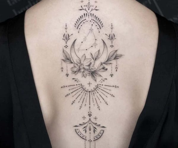 Delicate dotwork and fine linework create a mesmerizing spine piece that flows like celestial poetry down the back. The crescent moon cradling blooming florals speaks to feminine power and lunar cycles, while ornate mandala elements above and below frame the composition with sacred geometry ✨ A perfect blend of botanical beauty and mystical symbolism that transforms the spine into a work of art.