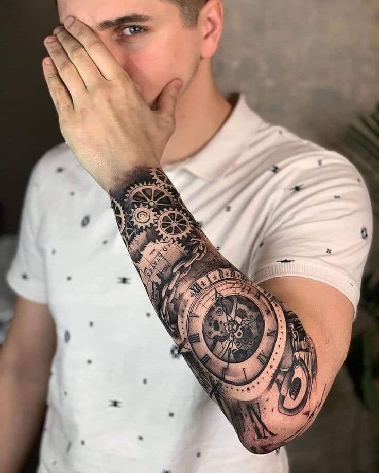 Intricate clockwork gears and Roman numerals spiral up this stunning forearm sleeve, creating a mesmerizing tribute to the passage of time ⏰ The masterful black and grey shading brings dimensional depth to each mechanical element, while the realistic clock faces seem to tick with life against the skin. Pure artistry meets meaningful symbolism in this perfectly executed biomechanical masterpiece.