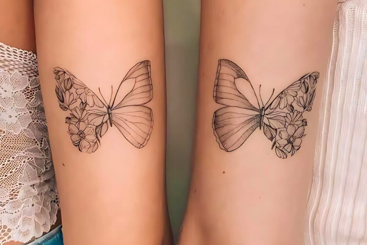 Mirrored across two arms, these delicate line-art butterflies create a stunning symmetrical display where flowers seamlessly blend into wing patterns. The intricate botanical details and fine linework showcase how matching tattoos can tell a complete story when brought together 🦋 Perfect for sisters, best friends, or anyone who believes in the beauty of connection through art.
