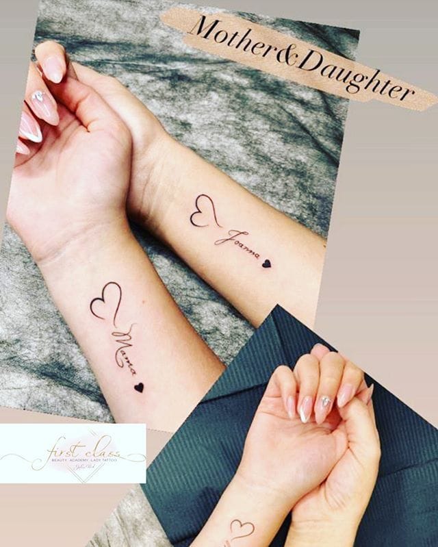 A tender tribute to an unbreakable bond, these matching mother-daughter tattoos feature delicate heart outlines paired with 