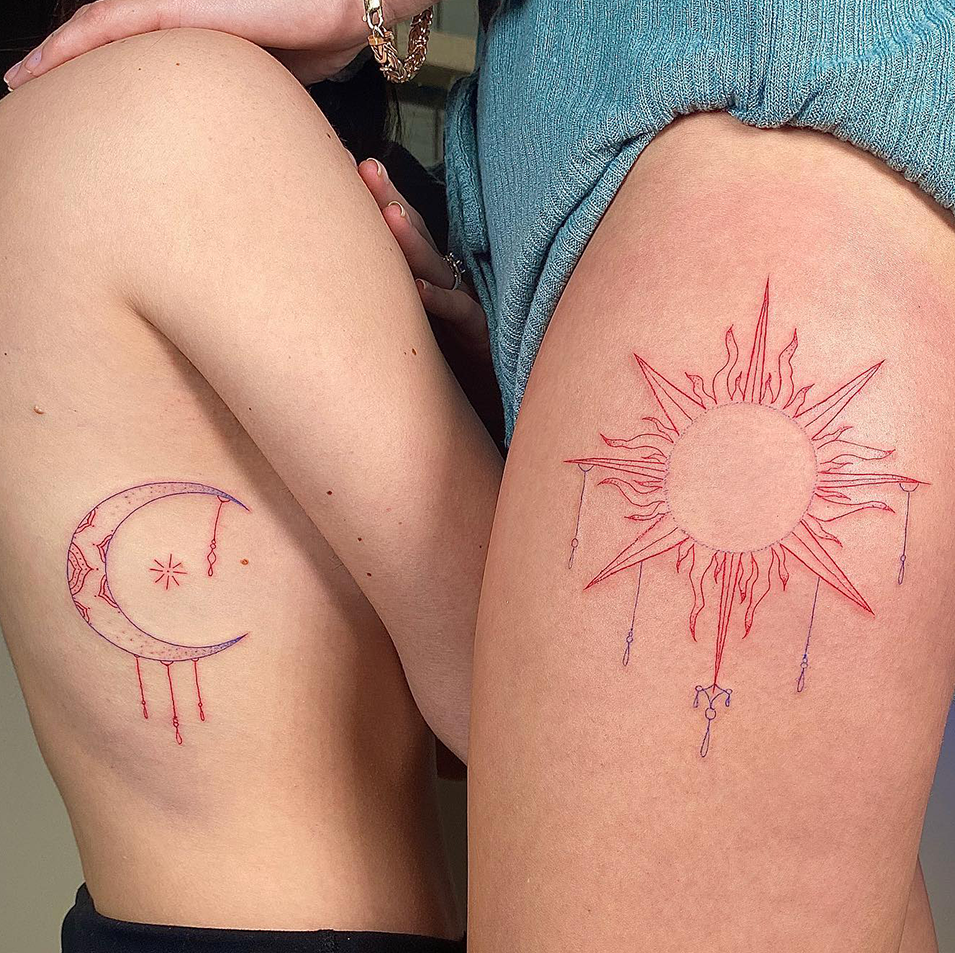 Celestial soulmates unite with these stunning complementary thigh tattoos featuring a delicate crescent moon and radiant sun design. The fine line red ink work creates an ethereal, almost watercolor-like effect that perfectly captures the eternal dance between day and night ☀️🌙 These matching pieces showcase how celestial symbolism can represent the beautiful balance found in partnership.