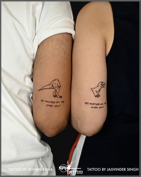 Two arms become a canvas for connection in this beautifully coordinated couple's tattoo featuring delicate line-drawn birds and the sweet sentiment 