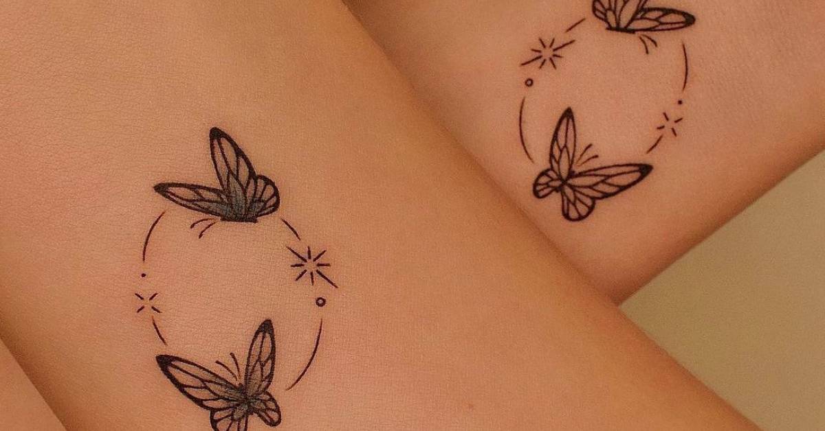 Delicate butterfly silhouettes dance across skin in an enchanting circular formation, connected by whimsical star trails and celestial sparkles ✨ The fine line work and strategic placement on what appears to be the thigh creates a mesmerizing constellation effect that feels both mystical and gracefully feminine. This dreamy design captures the essence of transformation and freedom through its flowing, interconnected composition.