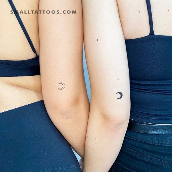 Mirrored crescent moons grace these forearms in perfect symmetry, creating an enchanting celestial bond between friends or partners 🌙 The delicate line work and thoughtful placement make these matching tattoos feel both intimate and astronomically inspired.