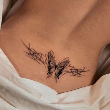 Delicate line work transforms into pure artistry with this stunning ribcage butterfly design that seems to flutter right off the skin. The intricate geometric elements and flowing sketchy lines create beautiful movement, while the intimate placement adds an element of personal significance that makes this piece truly special. ✨